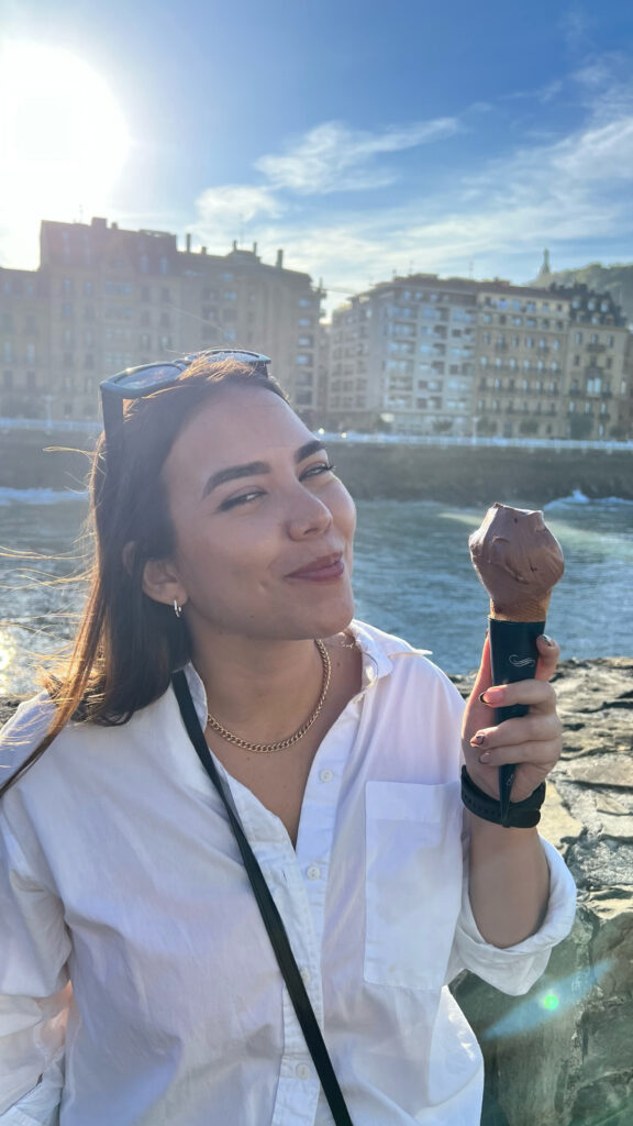 young woman eating chocolate ice cream